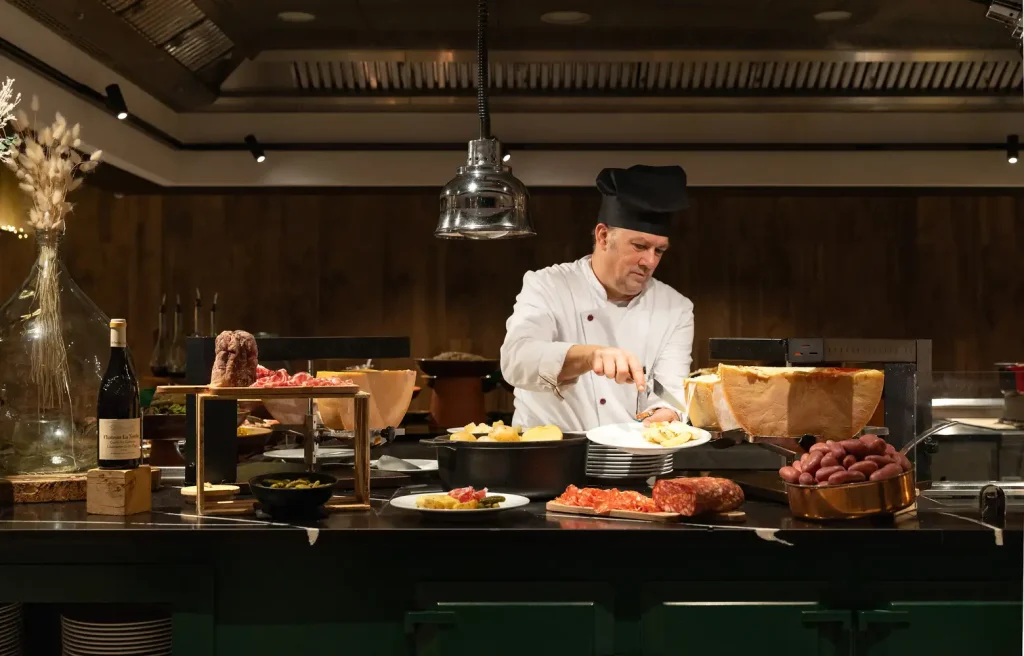 French chef preparing meal in Peisey Vallandry