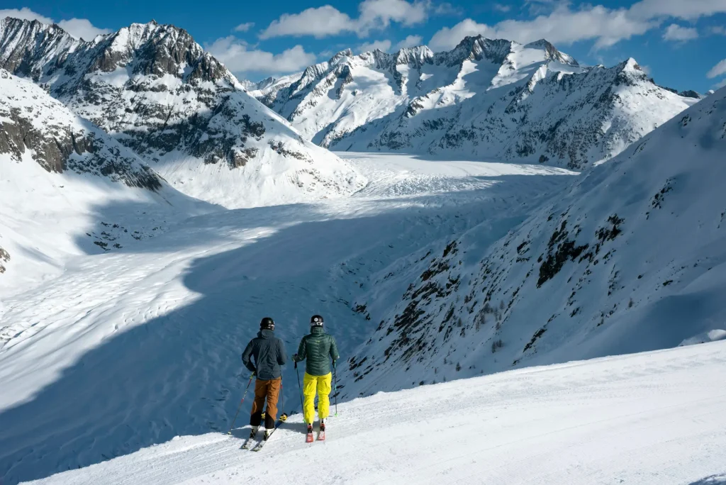 Skiers looking at the glacier in Aletsch Arena