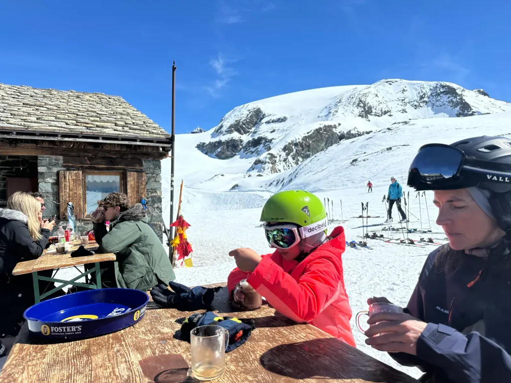 Family enjoying a snack on outdoor patio in Cervinia