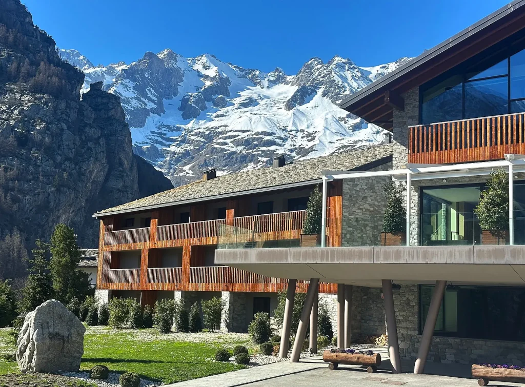 courmayeur 4 Alpine peaks behind a ski lodge in Courmayeur