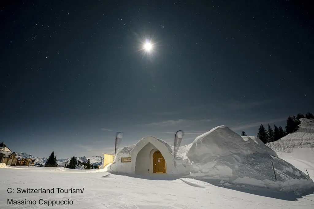 moonlight over a snowhut in Gstaad