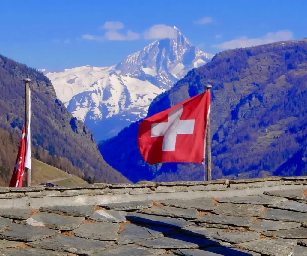 Swiss flag over Saas Fee village