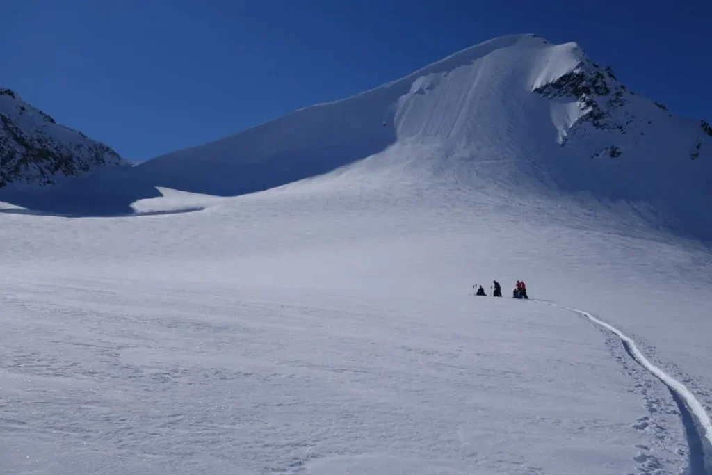 backcountry skiers crossing a snowfield