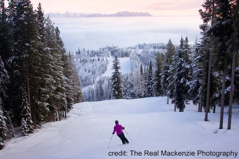 Kimberly Resort 3 woman skiing a groomed run at Kimberly in the late afternoon