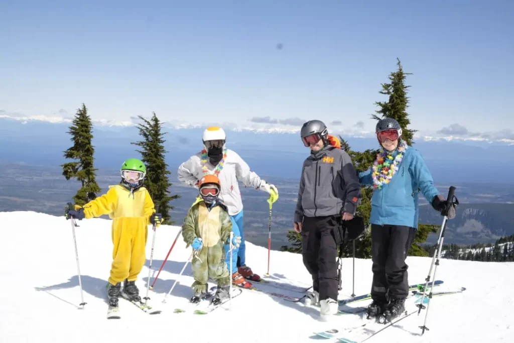 Mt Washington Resort 1 Family posing atop Mt. Washington Alpine Resort ski area