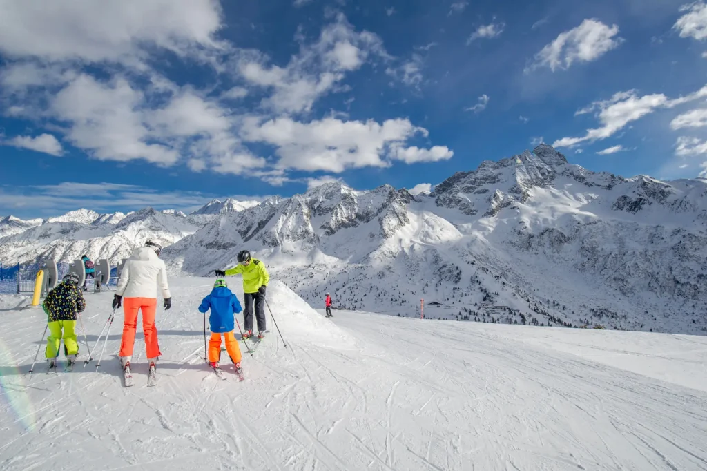 skiers atop Passo Tonale, Italy