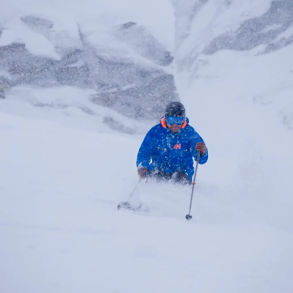 skier in deep powder on a snowy day in Revelstoke