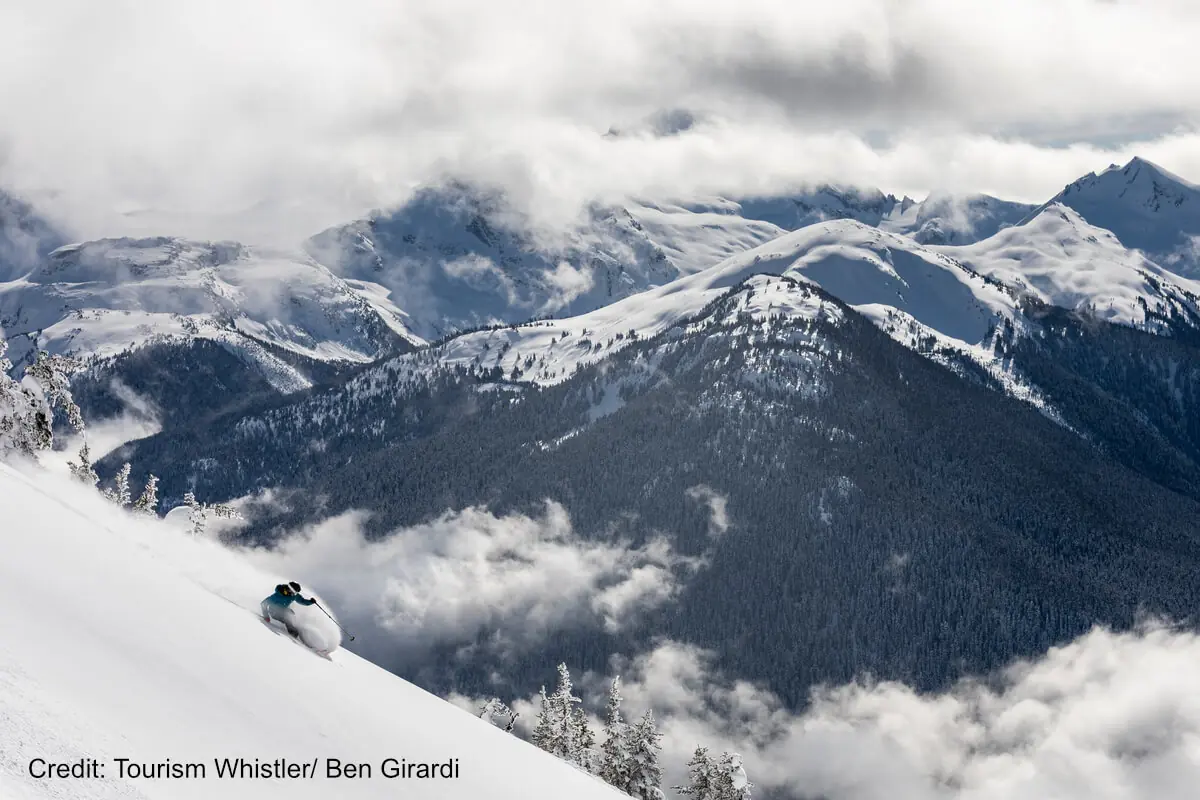 Ski Whistler 1 skier shredding powder atop Whistler Ski Resort