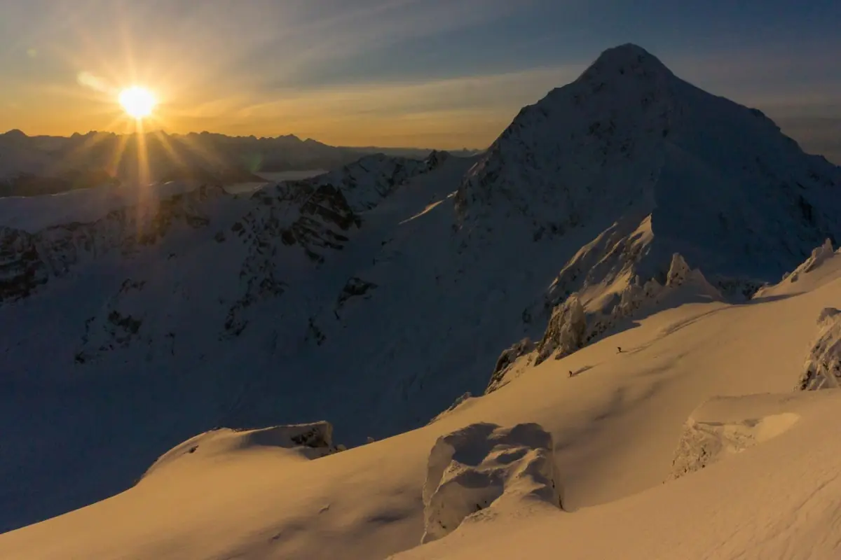 Westcoast Heli 1 sun setting on 2 skiers in the Skeena Bearclaw backcountry