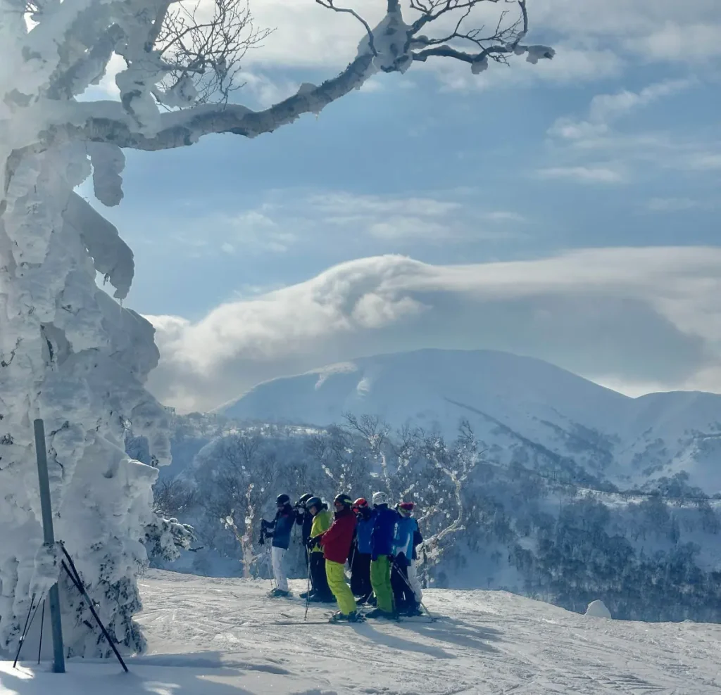 group of skiers atop Kiroro resort