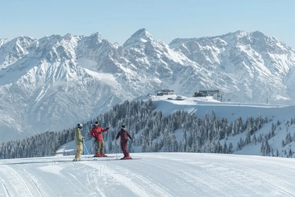 skiers at the top of Saalbach ski resort