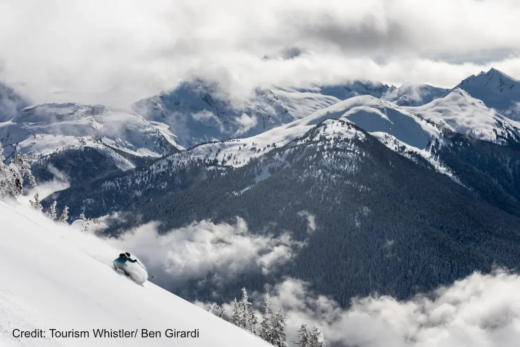 heli skier in deep powder near Whistler