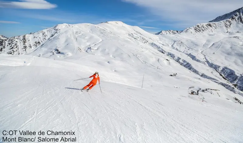 Skier on a groomed slope in Chamonix on a sunny day