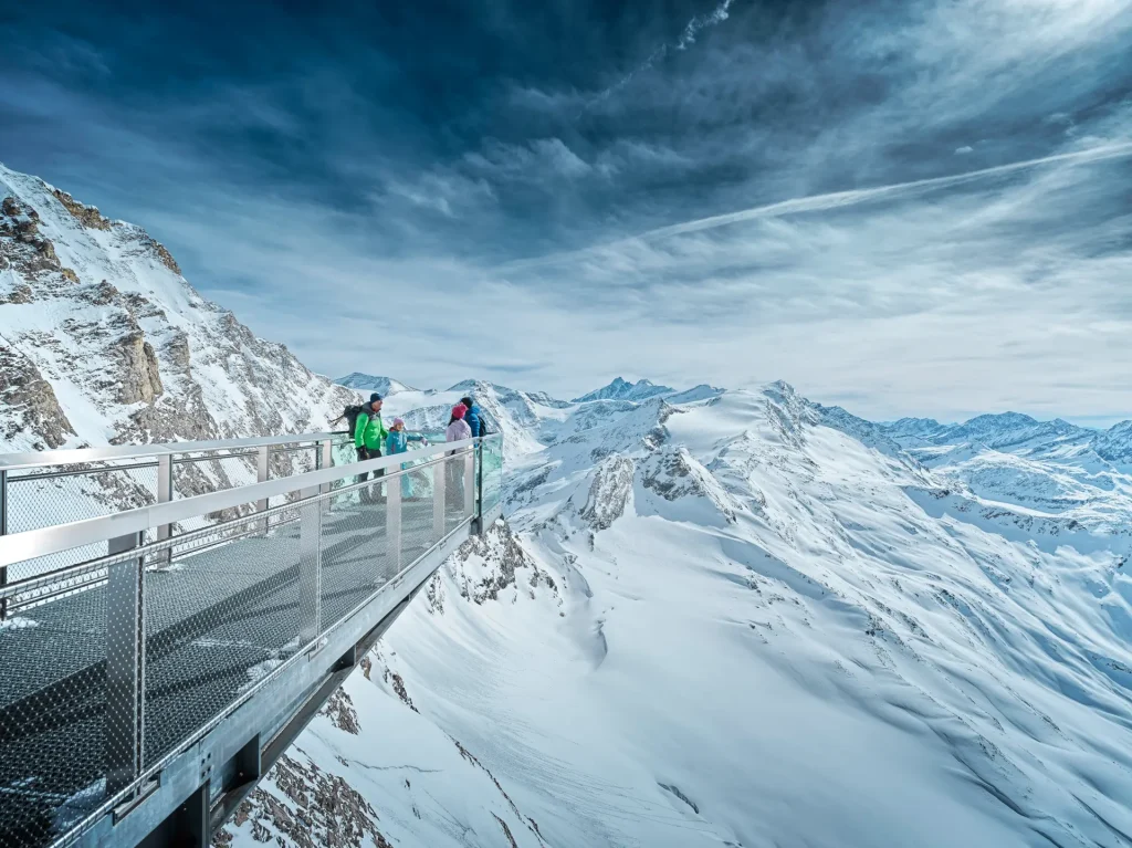 Guests standing atop a lookout at Zell am See