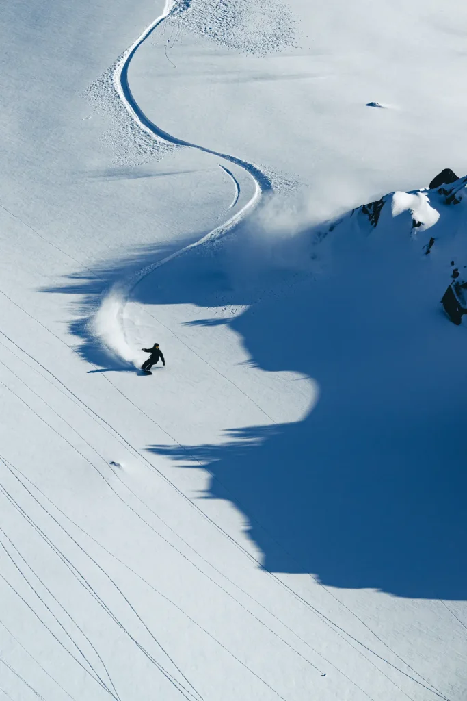 skier in fresh powder near Whitecap Alpine Adventure lodge