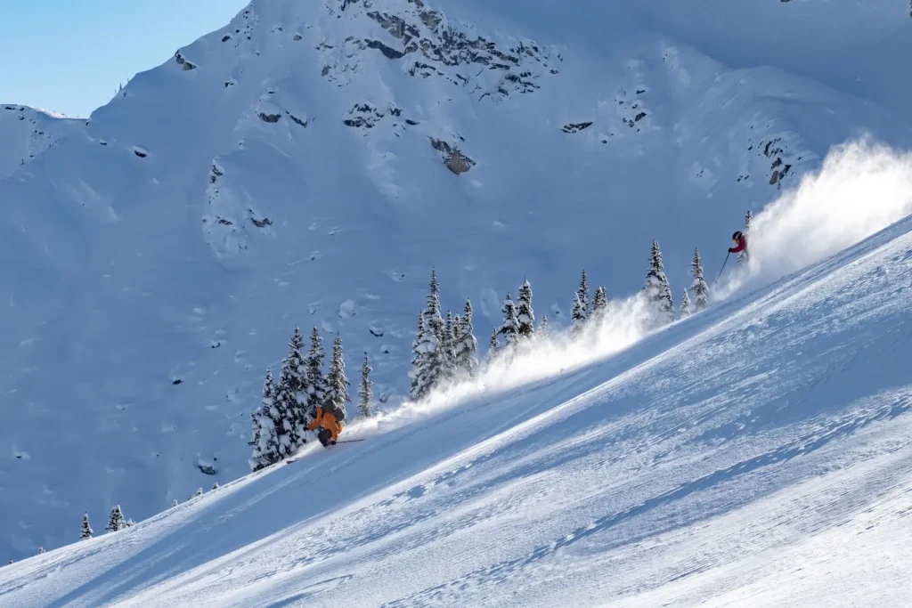 skiers getting first tracks outside Whitecap Alpine Adventure lodge