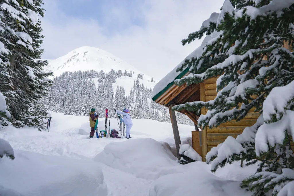 skiers preparing their gear outside Whitecap Alpine Adventure lodge