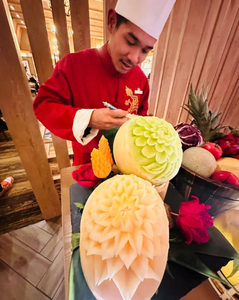 man carving fruit in Japan