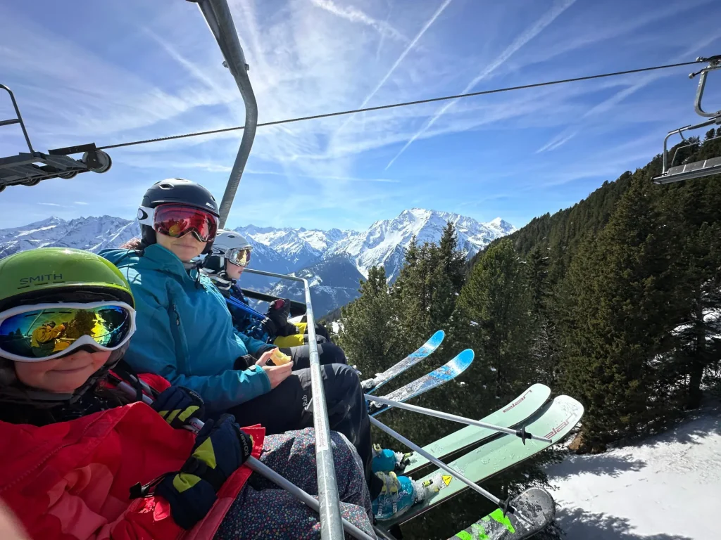 family of skiers on a chairlift