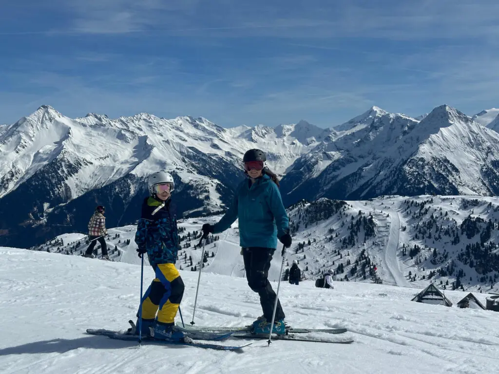 2 skiers atop the ski hill at Mayrhofen
