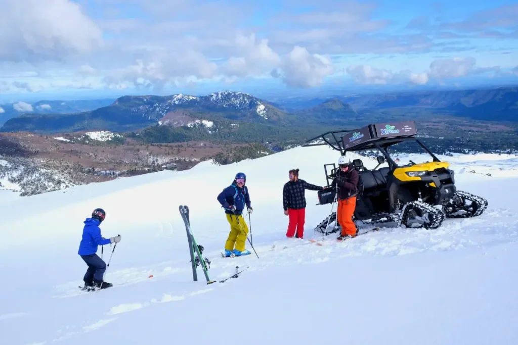 Group of skiers loading up on a snow machine