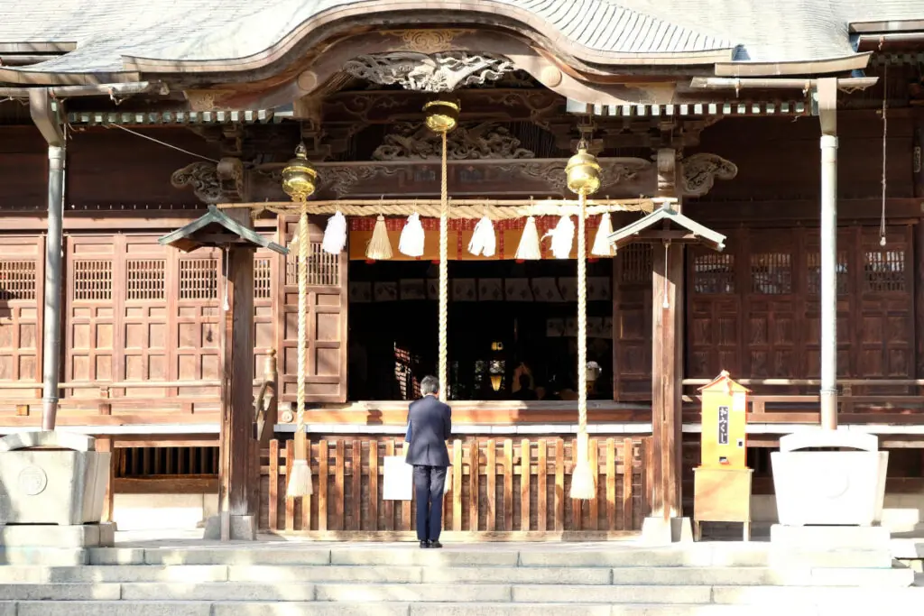 man in front of temple in Tokyo