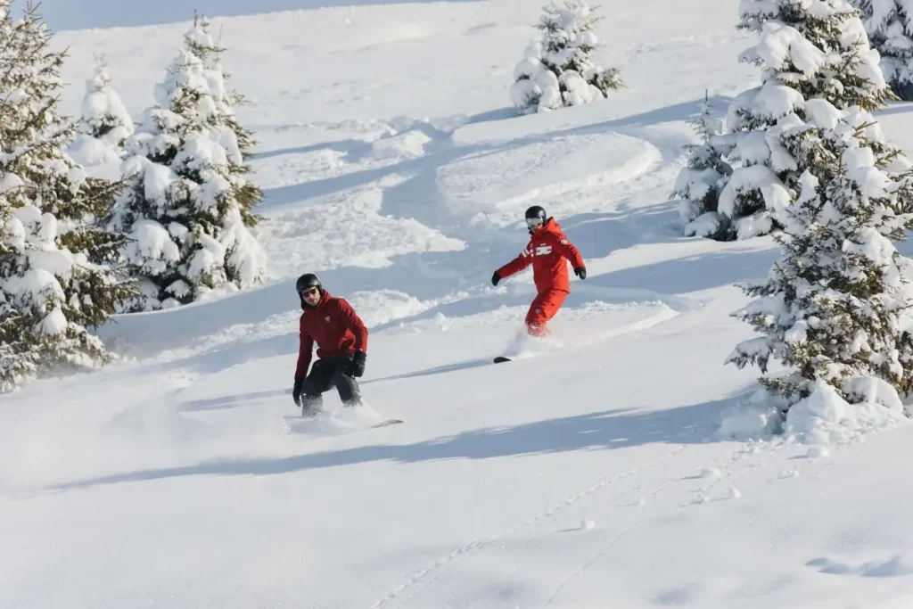 snowboarders in fresh powder at Valmorel