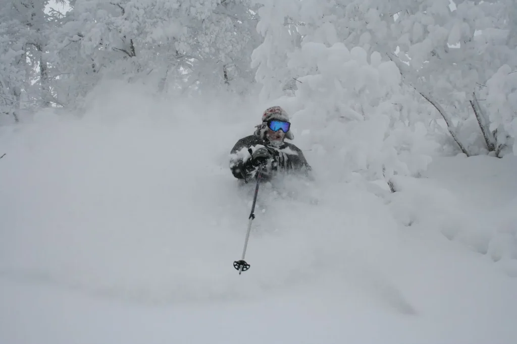 skier in deep powder at Furano Ski Resort, Japan