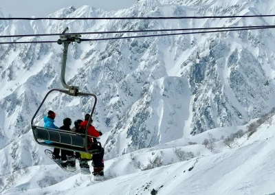 skiers on the chairlift in Hakuba, Japan